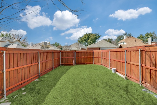 view of yard with a fenced backyard