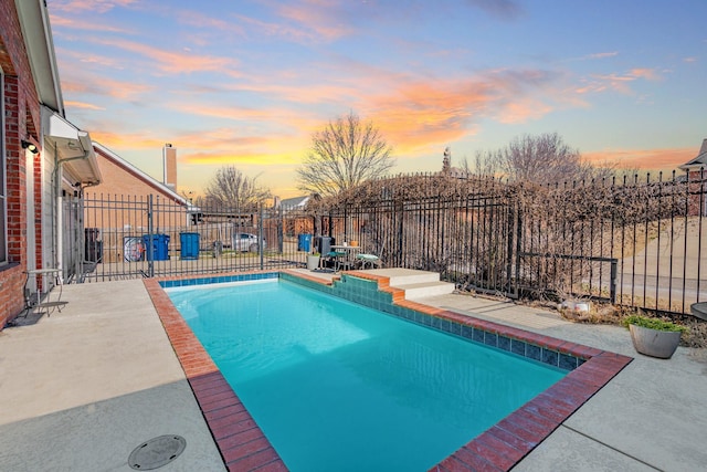 view of swimming pool with a patio, a fenced backyard, and a fenced in pool