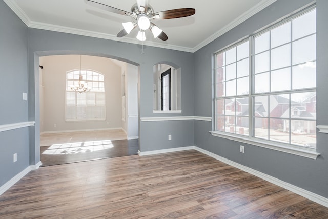 foyer entrance featuring crown molding, baseboards, wood finished floors, and ceiling fan with notable chandelier