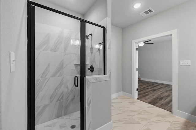 bathroom featuring marble finish floor, a stall shower, visible vents, and baseboards