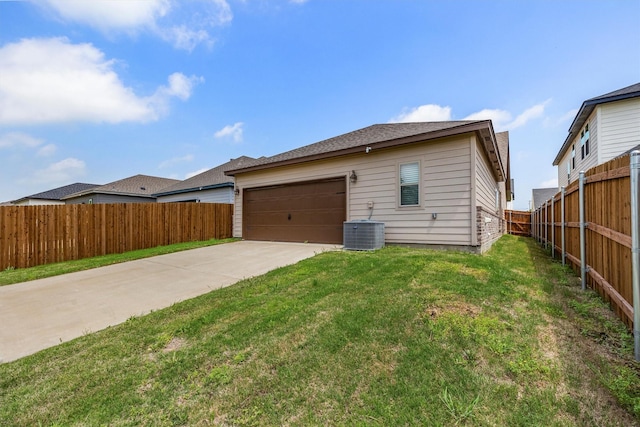 view of property exterior with cooling unit, concrete driveway, a yard, and fence