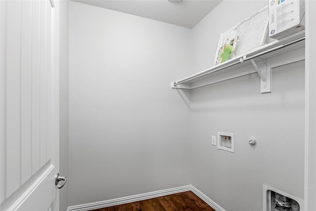 washroom with hookup for a washing machine, laundry area, baseboards, and dark wood-style flooring