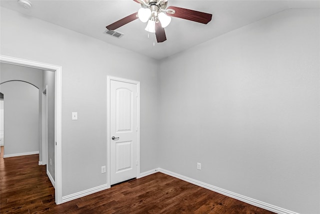 unfurnished bedroom featuring dark wood finished floors, visible vents, and baseboards