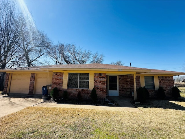 ranch-style house with a front yard, brick siding, driveway, and an attached garage