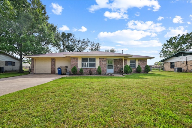 ranch-style home featuring an attached garage, brick siding, central AC unit, concrete driveway, and a front yard