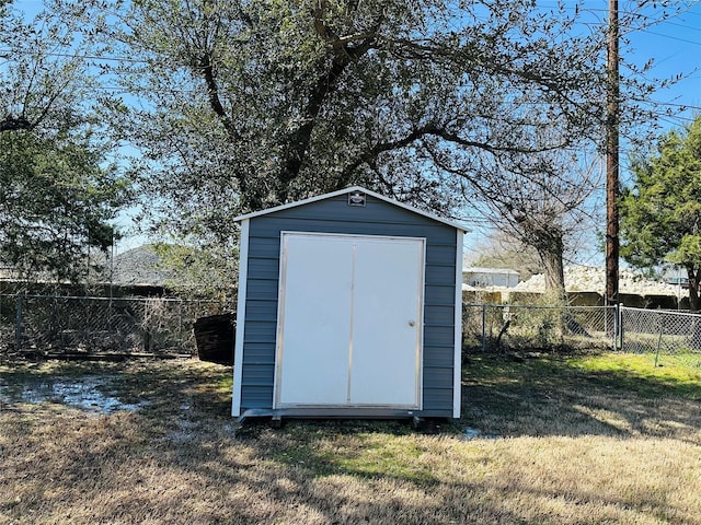 view of shed with a fenced backyard