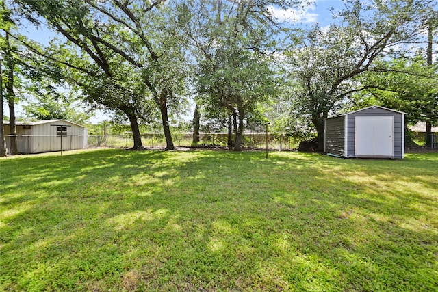 view of yard featuring an outbuilding and a storage shed