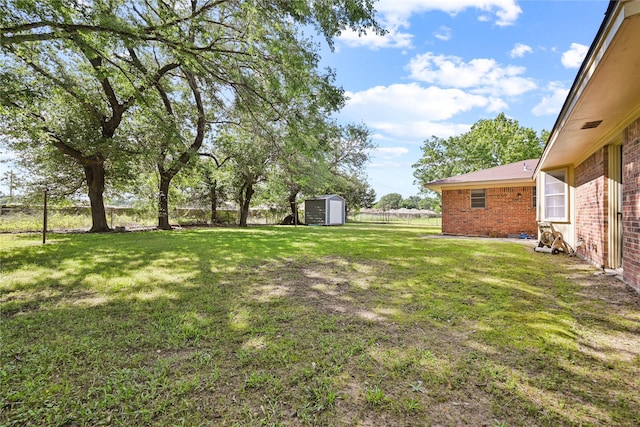 view of yard with a storage unit and an outdoor structure