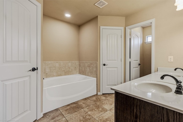 full bathroom with visible vents, a sink, a garden tub, and tile patterned floors