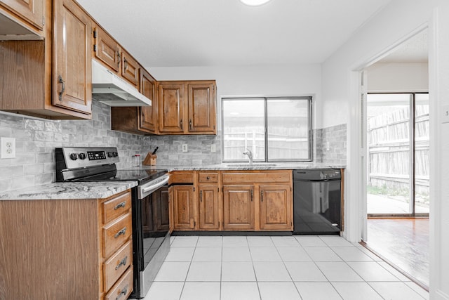 kitchen with black dishwasher, under cabinet range hood, stainless steel electric range oven, and a healthy amount of sunlight