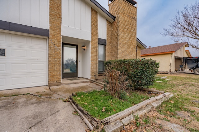 doorway to property with a chimney and board and batten siding