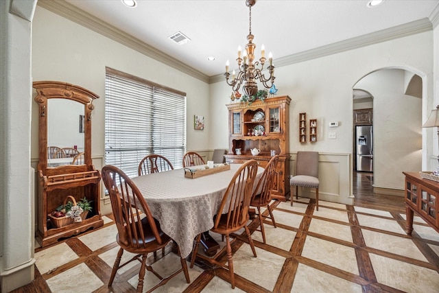 dining area with visible vents, arched walkways, ornamental molding, and recessed lighting