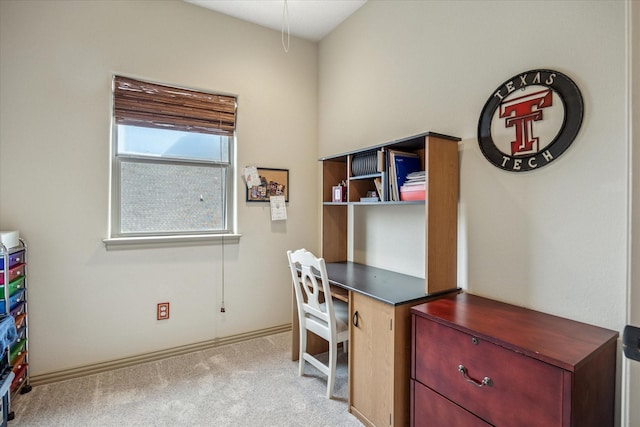 office with light carpet and baseboards