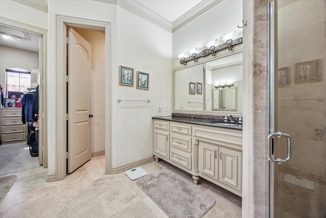 bathroom with a spacious closet, a stall shower, vanity, and crown molding