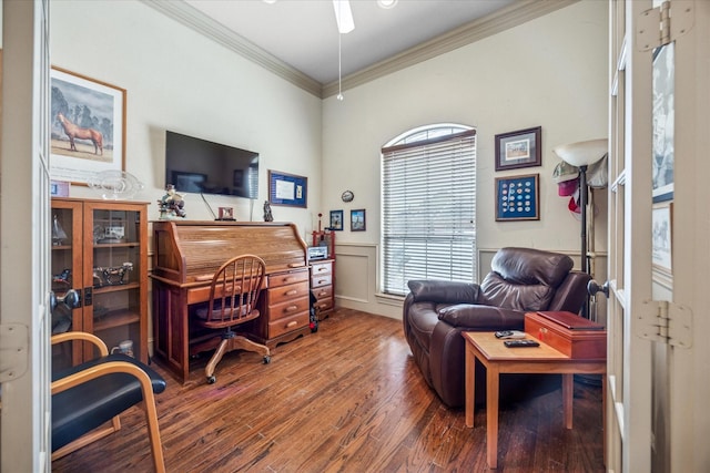 office featuring a ceiling fan, ornamental molding, and wood finished floors