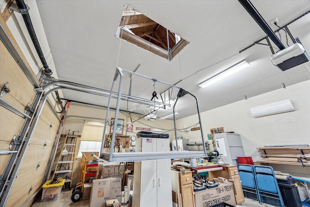 garage featuring an AC wall unit and a garage door opener