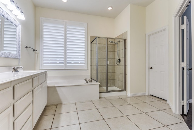 full bath with tile patterned flooring, vanity, a shower stall, a bath, and recessed lighting