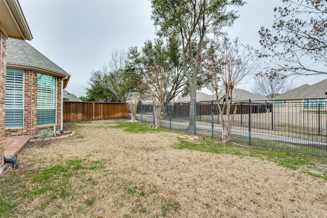 view of yard featuring fence private yard