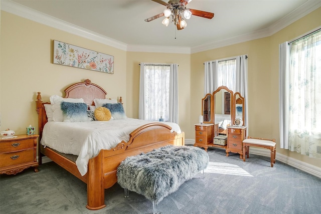 carpeted bedroom featuring ornamental molding, baseboards, and a ceiling fan