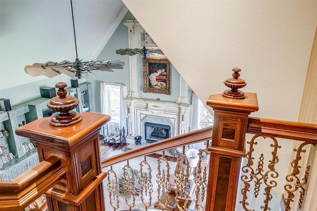 room details with a fireplace and a ceiling fan