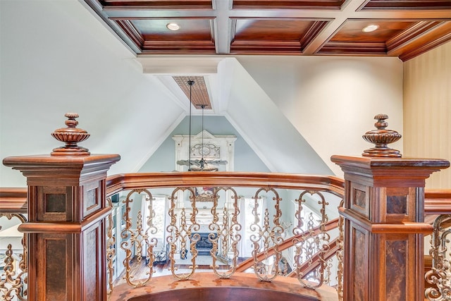 hall with ornamental molding, coffered ceiling, and beamed ceiling