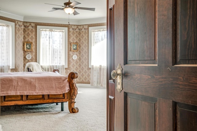 bedroom with baseboards, multiple windows, carpet flooring, and wallpapered walls