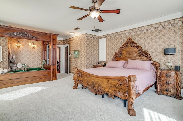 carpeted bedroom with ornamental molding, a ceiling fan, visible vents, and wallpapered walls