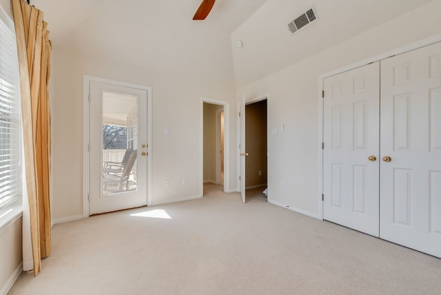 unfurnished bedroom featuring ceiling fan, light colored carpet, visible vents, access to exterior, and baseboards