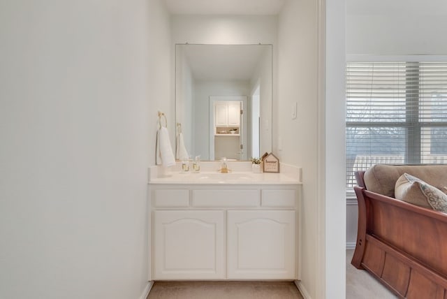 bathroom featuring baseboards and vanity