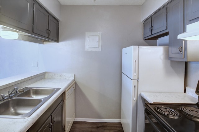 kitchen featuring baseboards, black range with electric stovetop, white dishwasher, under cabinet range hood, and a sink