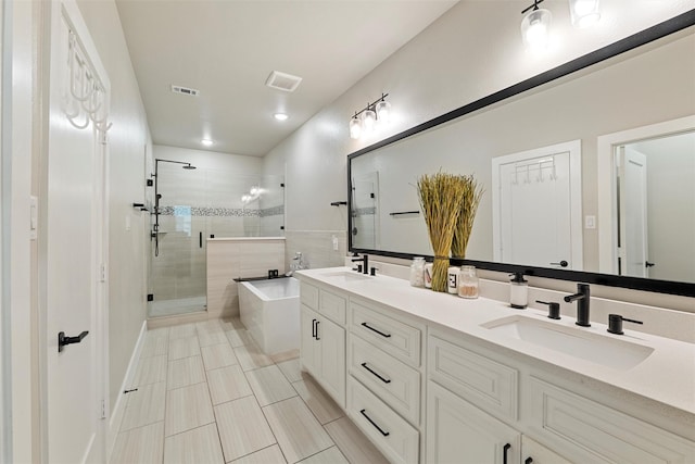 full bathroom featuring a bath, a stall shower, a sink, and visible vents