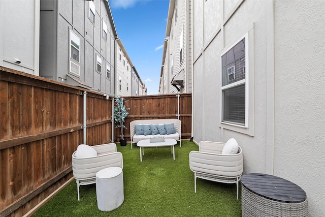 view of yard with a fenced backyard and an outdoor hangout area