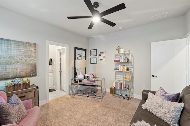 living area with a ceiling fan, baseboards, visible vents, and carpet flooring