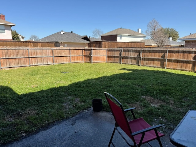 view of yard with a fenced backyard