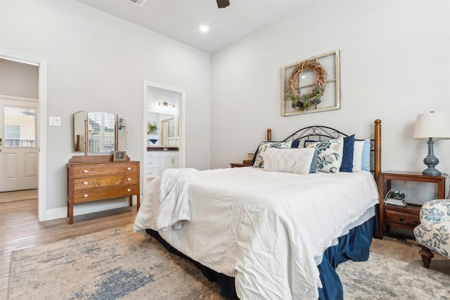 bedroom with recessed lighting, ensuite bathroom, a ceiling fan, wood finished floors, and baseboards