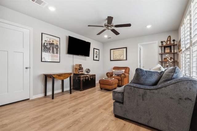 living area featuring light wood-style floors, recessed lighting, visible vents, and baseboards