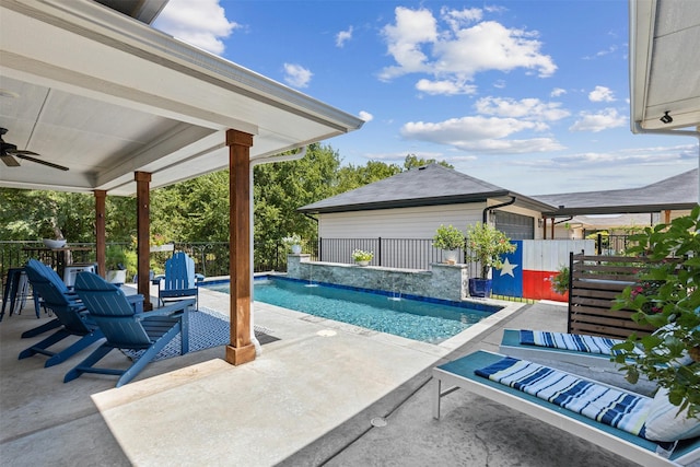 view of swimming pool featuring a patio area, a fenced in pool, fence, and a ceiling fan