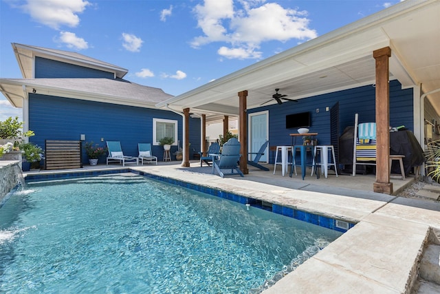 outdoor pool featuring a patio area and ceiling fan