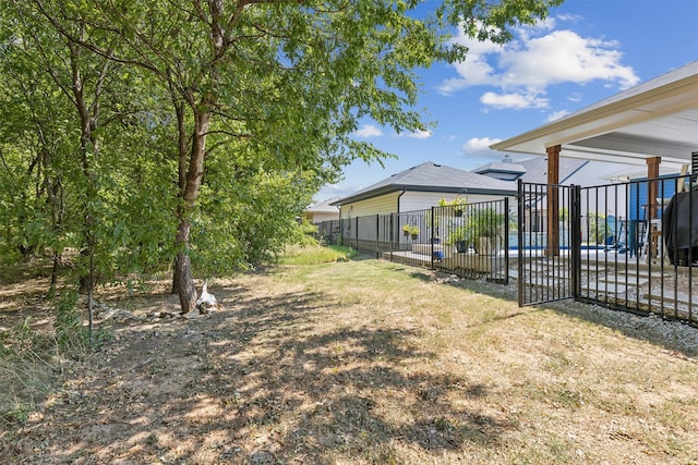 view of yard with fence and a patio