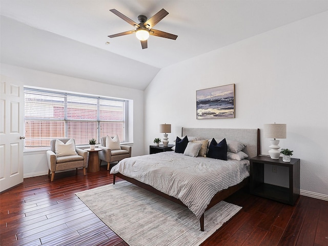 bedroom with lofted ceiling, hardwood / wood-style floors, a ceiling fan, and baseboards