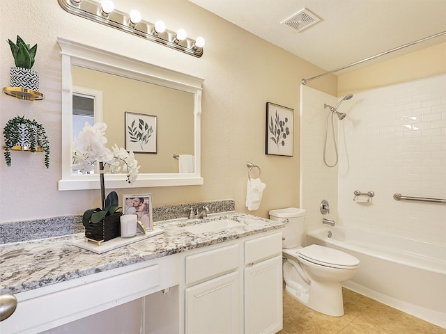 full bathroom featuring toilet, bathing tub / shower combination, vanity, visible vents, and tile patterned floors