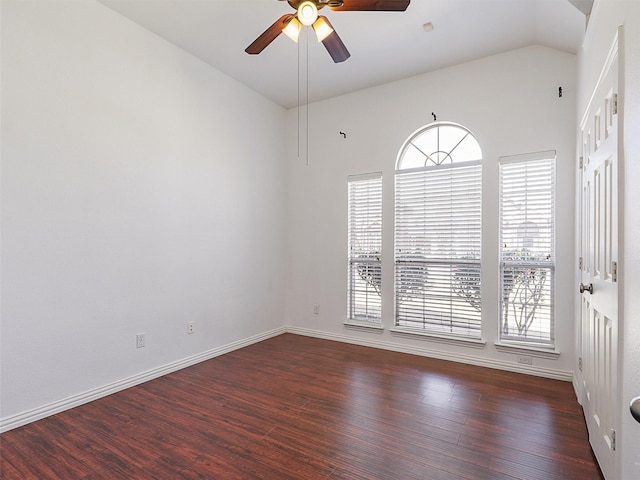 unfurnished room featuring vaulted ceiling, wood finished floors, a ceiling fan, and a healthy amount of sunlight