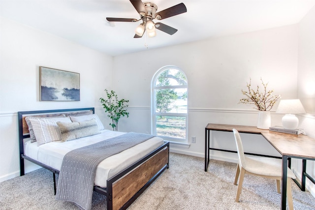 bedroom featuring carpet and baseboards