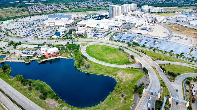 drone / aerial view featuring a water view and a city view