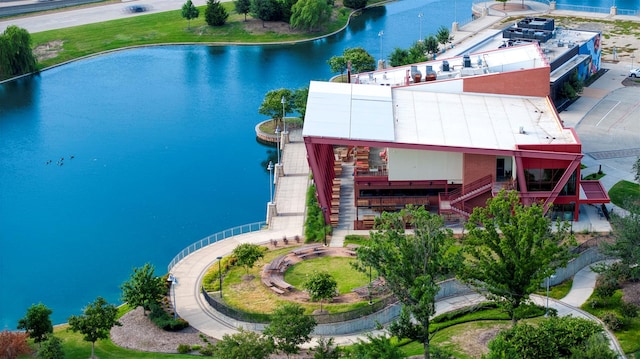 birds eye view of property with a water view