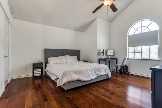 bedroom featuring lofted ceiling, ceiling fan, baseboards, and hardwood / wood-style flooring