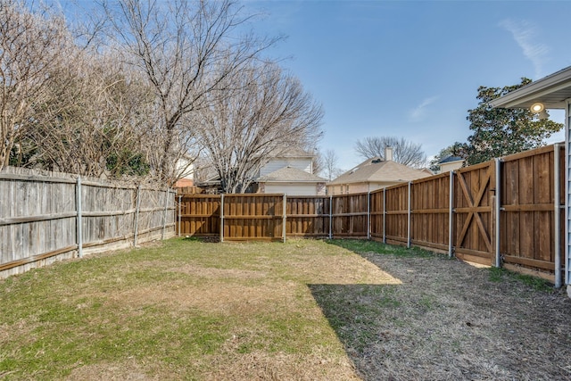 view of yard featuring a fenced backyard