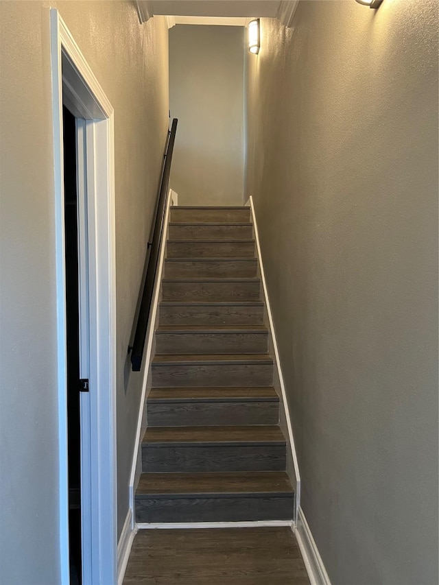 9444 Ferrara Dr, Shreveport, LA 71118 - stairway with baseboards and wood finished floors