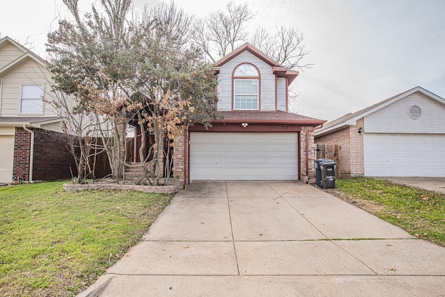 traditional home featuring a front yard, concrete driveway, brick siding, and an attached garage