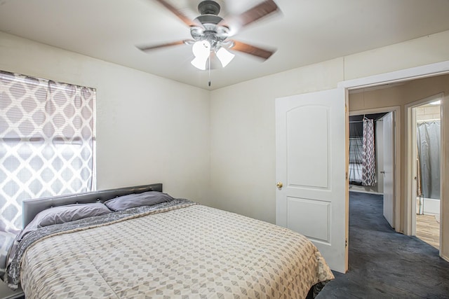 bedroom featuring dark colored carpet and a ceiling fan